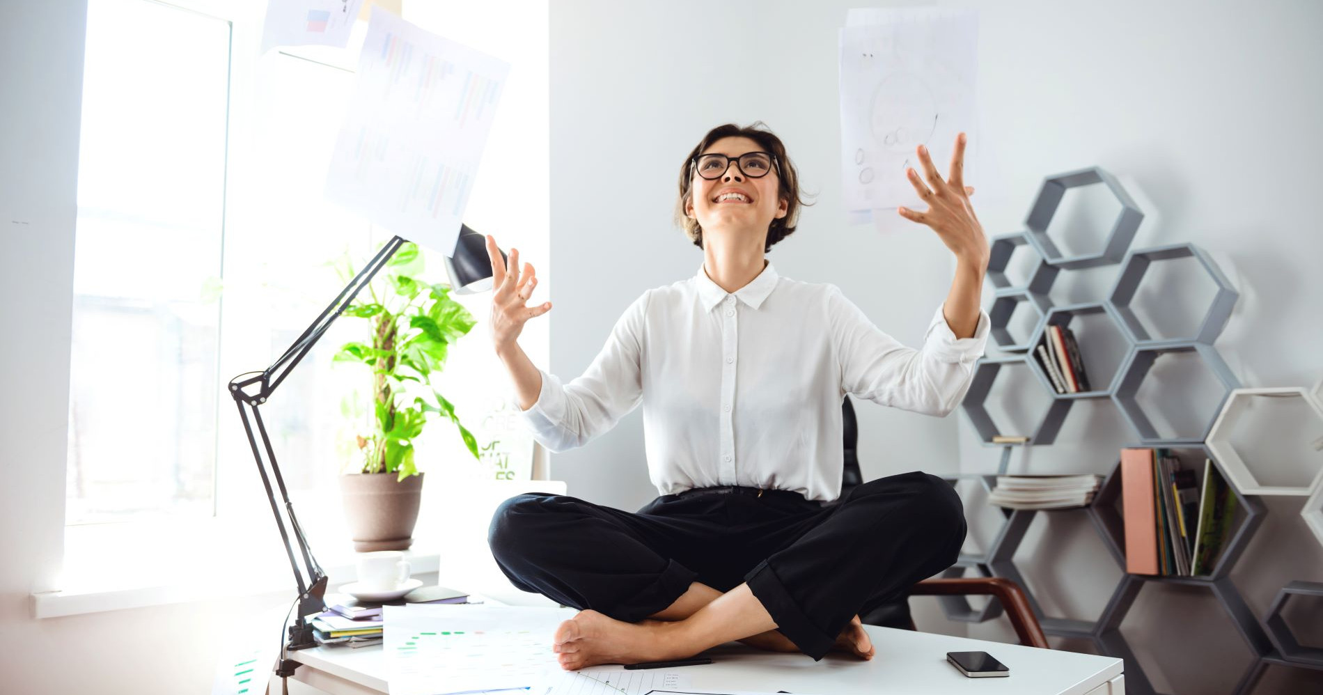 freepik-young-beautiful-businesswomen-glasses-smiling-throwing-up-papers