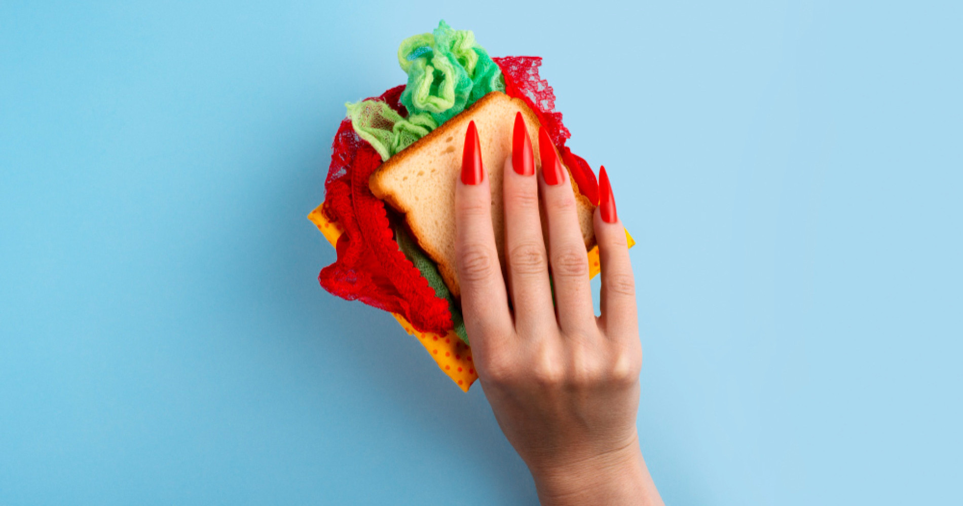 Ilustrasi kuku panjang dan berwarna menggenggam makanan